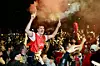 Arsenal fans celebrate their team winning the English Premier League title outside the Emirates Stadium in London on May 19. [AP/YONHAP]
