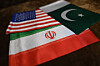 Clockwise from top: Flags of the United States, Iran and Pakistan are seen at a shop in Karachi, Pakistan, on April 17. [EPA/YONHAP]
