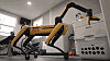 Spot four-legged robot dog, which became smarter with Google Gemini AI, is taking a dog for a walk. [BOSTON DYNAMICS]