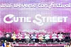 Pink festival stage with performers and large Cutie Street lettering at the 2026 Weverse Con Festival.