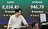 A screen in Hana Bank's trading room in central Seoul shows the Kospi and Kosdaq opening on June 8.