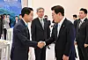 Parliamentary Speaker Cho Jeong-sik, left, shakes hands with President Lee Jae Myung at the Blue House in central Seoul on June 8.