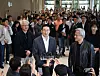 LG Group Chairman Koo Kwang-mo speaks to reporters in a crowded lobby at LG Twin Tower in Seoul.