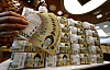 A person holds 50,000-won ($32) bills at bank in central Seoul on Feb. 24.