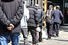 Older adults wait in line to eat at a free-of-charge eatery in Jongno District in central Seoul on March 24, 2025.