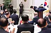 President Lee Jae Myung bows in a luncheon inviting older adults at the Blue House in central Seoul in December 2025.