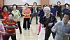 Older adults participate in a group exercise session at a local community center in Suwon, Gyeonggi, in September 2018.
