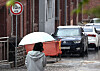 A person walks with an umbrella as rain and hail fall in Daegu on April 6.