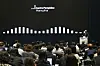 A speaker stands at a podium during a Pompidou Center Hanwha press briefing in Seoul.