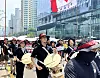 Protesters march while playing Korean drum during a rally staged by unionized laborers from Kakao and its affiliate companies in Gyeonggi on June 10.