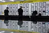 People stand in front of job postings at the city-run recruitment agency in western Seoul on June 11.