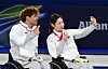 Lee Yong-seok, left, and Baek Hye-jin, who won silver in wheelchair curling mixed doubles at the 2026 Milan-Cortina Winter Paralympics, at the Cortina Curling Olympic Stadium in Cortina, Italy, pose for a selfie on March 11. [JOINT PRESS CORPS]
