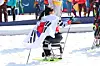 Kim Yun-ji celebrates after winning silver with a time of 33:10.1 in the para cross-country skiing women's sprint sitting at the 2026 Milan-Cortina Winter Paralympics at the Tesero Cross-Country Skiing Stadium in Italy on March 10. [KOREA PARALYMPIC COMMITTEE]