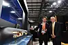 Jeong Sung-kyun, left, vice president of naval ship overseas business at Hanwha Ocean, introduces a model of KSS-III submarine Victor Fedeli, Ontario's Minister of Economic Development, at the company's booth during CANSEC 2026 in Ottawa, Canada. [HANWHA OCEAN]
