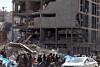 People gather next to a damaged building around Ferdowsi Square after an airstrike in central Tehran, Iran on March 3. [EPA/YONHAP]