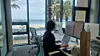 A person works at a coworking space in Jeju City, Jeju, in a photo uploaded to Jeju Workation website on April 30. [JEJU WORKATION]