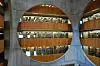 The central atrium of the Exeter Library, designed by American architect Louis Kahn. Stacks and reading areas unfold across multiple levels beyond the circular openings. [LIM YEONG-HWAN]