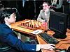 Garry Kasparov, the world chess champion, sits deep in thought ahead of the sixth game of the human-versus-computer chess match held in New York in May 1997. In the foreground, an IBM computer engineer operates the chess supercomputer Deep Blue. [AFP/YONHAP]