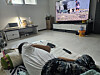 A resident surnamed Gong, who has a severe brain lesion disability and lives alone in an officetel in Jung District, Incheon, watches TV in his home on March 13. [BYUN MIN-CHUL]