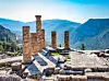 Ruins of the ancient Temple of Apollo at Delphi, overlooking the valley of Phocis. [WIKIPEDIA]