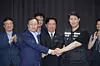 Labor Minister Kim Young-hoon, center, Samsung Electronics' management negotiator Yeo Myung-koo, left, and Choi Seung-ho, right, head of the Samsung Electronics chapter of the Samsung Group United Union, shake hands after signing a tentative wage agreement for 2026. [YONHAP]