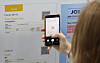 A participant scans a QR code to access job posts of positions offered at the Job Fair for International Students on May 19, 2025. [YONHAP]