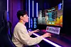 A model demonstrates LG Display's gaming OLED display. [LG DISPLAY]