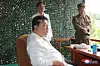 North Korean leader Kim Jong-un oversees a test launch of the new Hwasong-18 solid-fueled intercontinental ballistic missile on July 12, 2023, where an object believed to be a foldable smartphone, shown inside the red circle, was spotted, in this image provided by the Korean Central News Agency. [YONHAP]