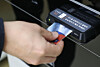 A customer pays with their credit card at a supermarket in Seoul on Dec. 15, 2022. [YONHAP]