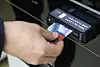 A customer pays with their credit card at a supermarket in Seoul on Dec. 15, 2022. [YONHAP]