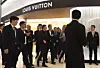 Bernard Arnault, chairman and chief executive of LVMH, center, leaves the Louis Vuitton store at Lotte World Tower in Songpa District, southern Seoul, on May 11. [YONHAP]