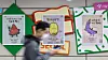 A person walks past posters to help people from psychological isolation at a subway station in eastern Seoul in April 2025. [NEWS1]