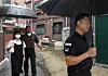 A security officer and Seoul city officials demonstrate a private security service for stalking victims as part of a support program on Sept. 13, 2023. [YONHAP]