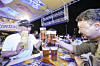 Visitors enjoy fried chicken and beer at the 2025 Daegu Chimac Festival in Daegu on July 9, 2025. [NEWS1]