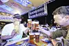 Visitors enjoy fried chicken and beer at the 2025 Daegu Chimac Festival in Daegu on July 9, 2025. [NEWS1]