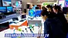 North Koreans look at smartphones during the light industrial goods exhibition ″Development of Light Industry-2025,″ which opened on Oct. 9, 2025, at the Light Industry Hall of the Three-Revolution Exhibition House, according to a Korean Central Television report on Oct. 15, 2025. [YONHAP]