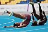 Joel Jin Nwamadi of Yecheon County Office, left, who won the men’s 100-meter final, and Biwesa Daniel Gashama of Ansan City Hall, who finished fourth, celebrate after checking their times at the 106th National Sports Festival held in Busan on Oct. 19, 2025. [YONHAP]