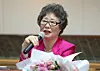 Choi Mal-ja, who was previously found guilty for biting the tongue of a man who attempted to rape her 61 years ago, answers questions at a press conference following a retrial sentencing hearing at the Busan District Court on Sept. 10, 2025. She was acquitted in the retrial. [YONHAP]