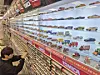 A customer browses mini car figures at the Toys“R” Us Jamsil branch in Songpa District, southern Seoul, on April 2. [LOTTE MART]