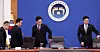 President Lee Jae Myung takes his seat after the national pledge at an emergency economic review meeting at the presidential office in Seoul on the morning of March 26. [JOINT PRESS CORPS]