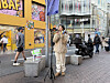 Chinese influencer Wang Yiwei reenacts a scene of doing livestreams in Myeongdong street in central Seoul on March 19. [LEE SOO-JUNG]