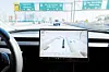 A 2025 Tesla Model 3 equipped with FSD 14.1.4 drives autonomously on a highway in Los Angeles. [REUTERS/YONHAP]