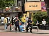 People smoke around an ashtray bin in Hongdae in Mapo District, western Seoul, on May 2. [SHIN MIN-HEE]