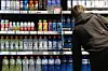A customer looks at sports drinks stocked at a supermarket in Seoul on April 14, 2025. [NEWS1]