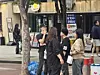 People smoke around an ashtray bin in Hongdae in Mapo District, western Seoul, on May 2. [SHIN MIN-HEE]