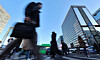 Office workers are seen in central Seoul on Feb. 19. [NEWS1]