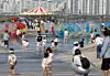 Children play by the Han River in Mapo District, western Seoul, on April 12. [YONHAP]