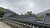 A sea emerges beyond tiled rooftops of Buddhist temples in Baengneyonsa temple [WOO JI-WON]