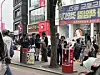 People smoke around an ashtray bin in Hongdae in Mapo District, western Seoul, on May 2. [SHIN MIN-HEE]