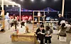 People read books themed around the sea at the “Beach Book Lounge” during the Gwangalli Beach Book Fair, held at Manam Plaza on Gwangalli Beach in Busan on the afternoon of Sept. 20, 2025. [YONHAP]